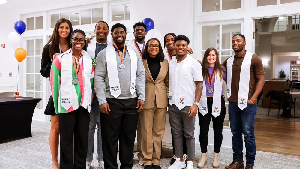 Group of people posing with medals