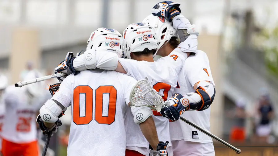 lacrosse players celebrating on the field
