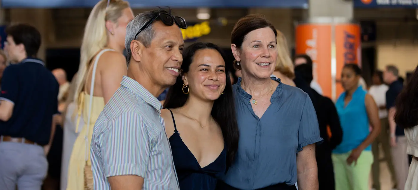 Grad social posing with parents