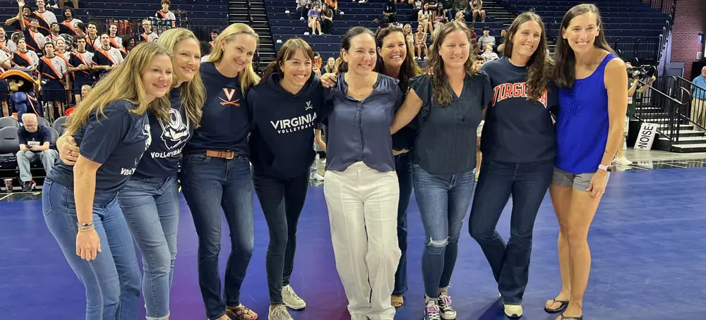 Women posing with arms around each other