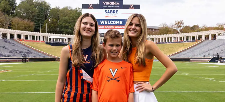 A family posing on the field