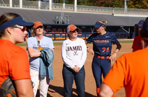 Group of women standing on softball field